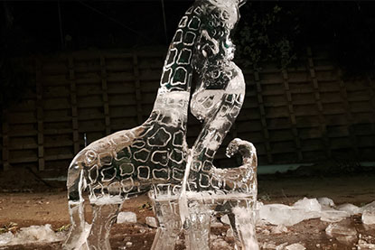 900 lb ice sculpture created live by Fitzysnowman Studios 